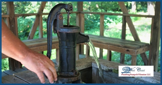 A well pump outside of a residential home.